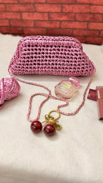 Crocheted metallic clutch